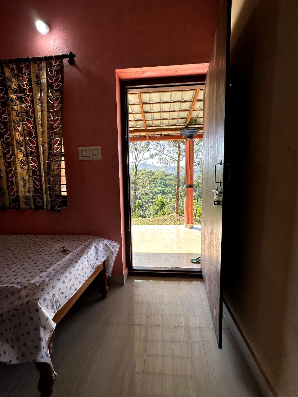 Homestay room opening to a veranda with hill views, near Horanadu and Kalasa